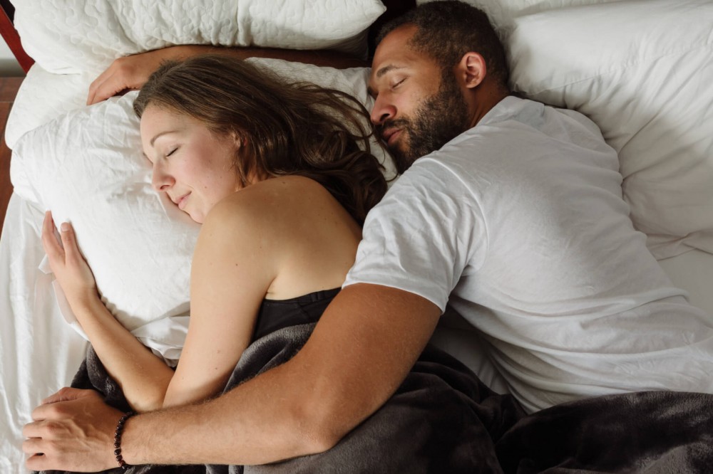 Couple sleeping in bed